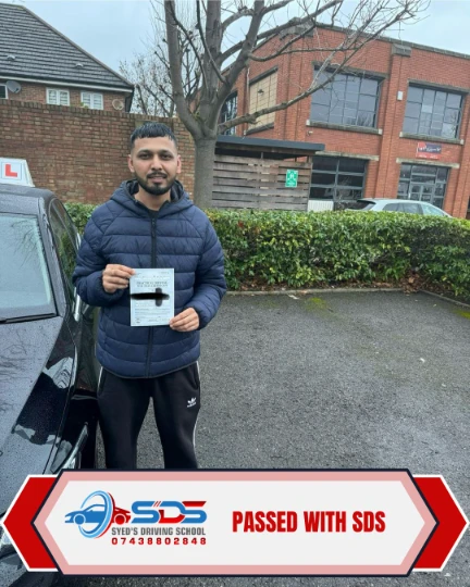 Learner celebrating a practical driving test pass